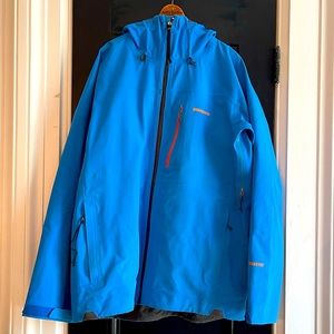 Patagonia, Gore-Tex ski snowboard jacket size large blue with a orange accents